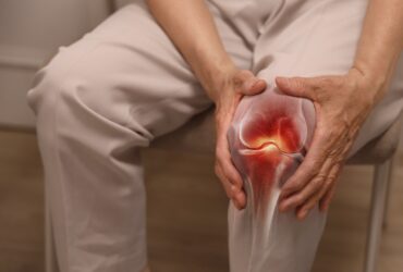Close-up,Of,An,Elderly,Woman,Holding,Her,Knee,With,Her
